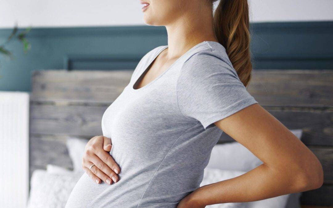 Young pregnant woman suffering from backache