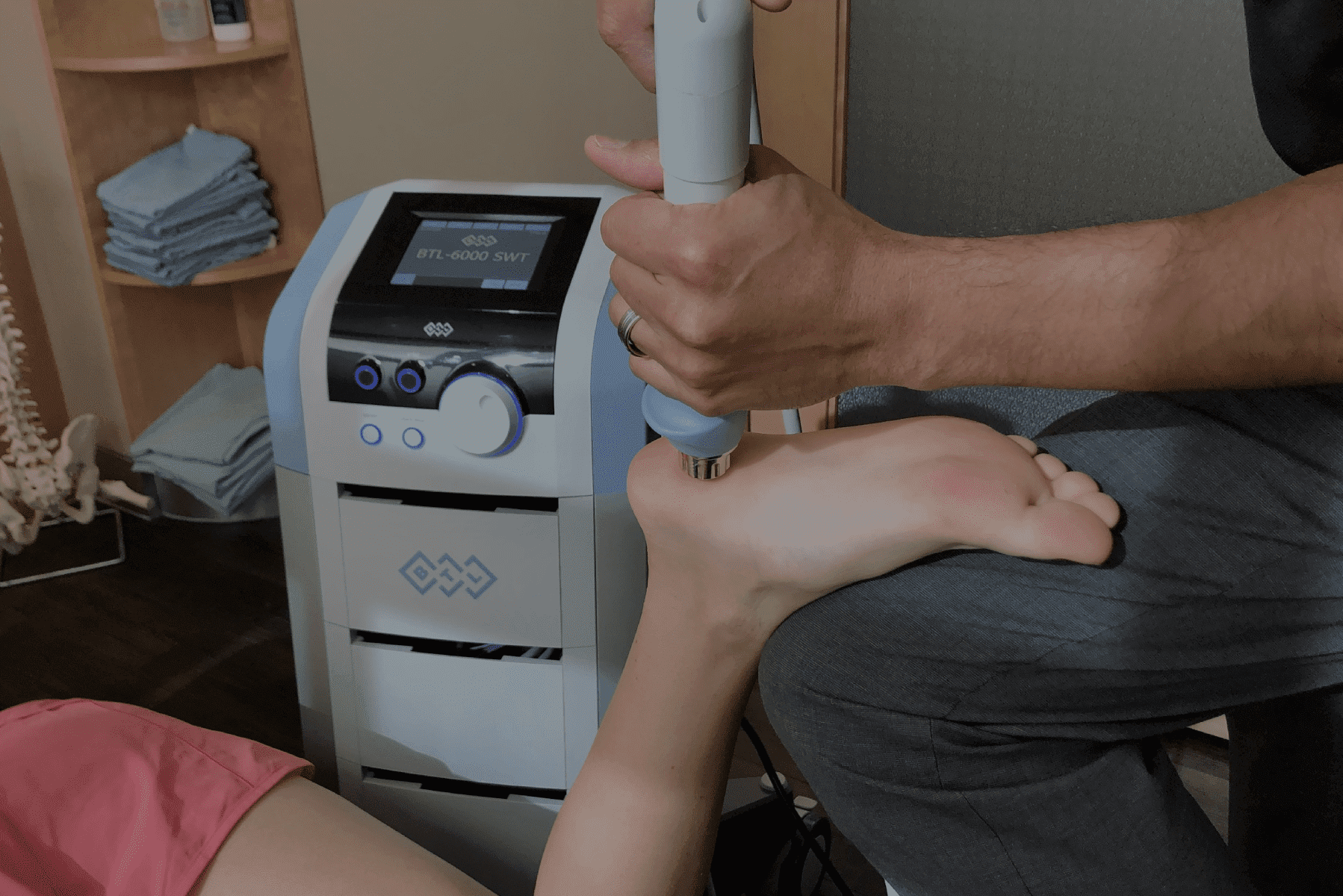 Woman Is Getting Foot Massaged In Shockwave Therapy